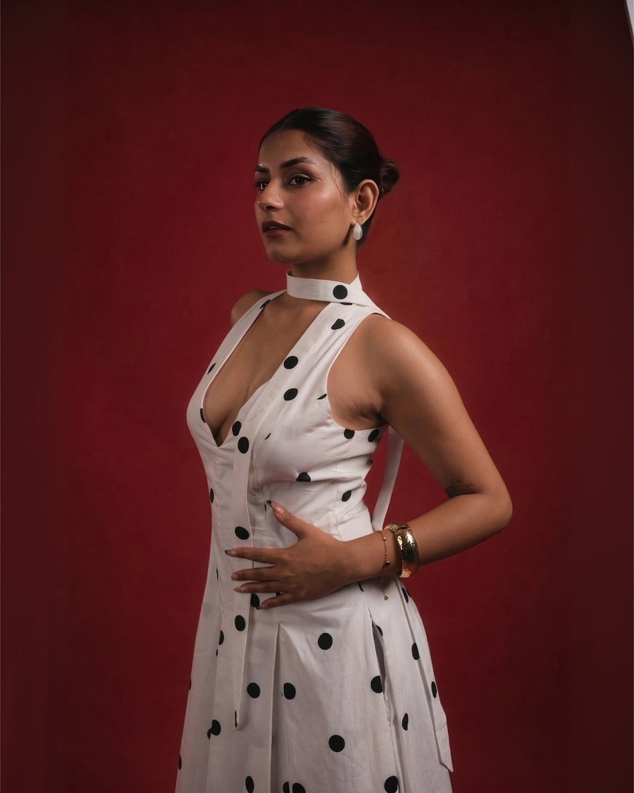 DOMINADOT white polka dot halter midi dress with fitted bodice – three-quarter view – YUMIS