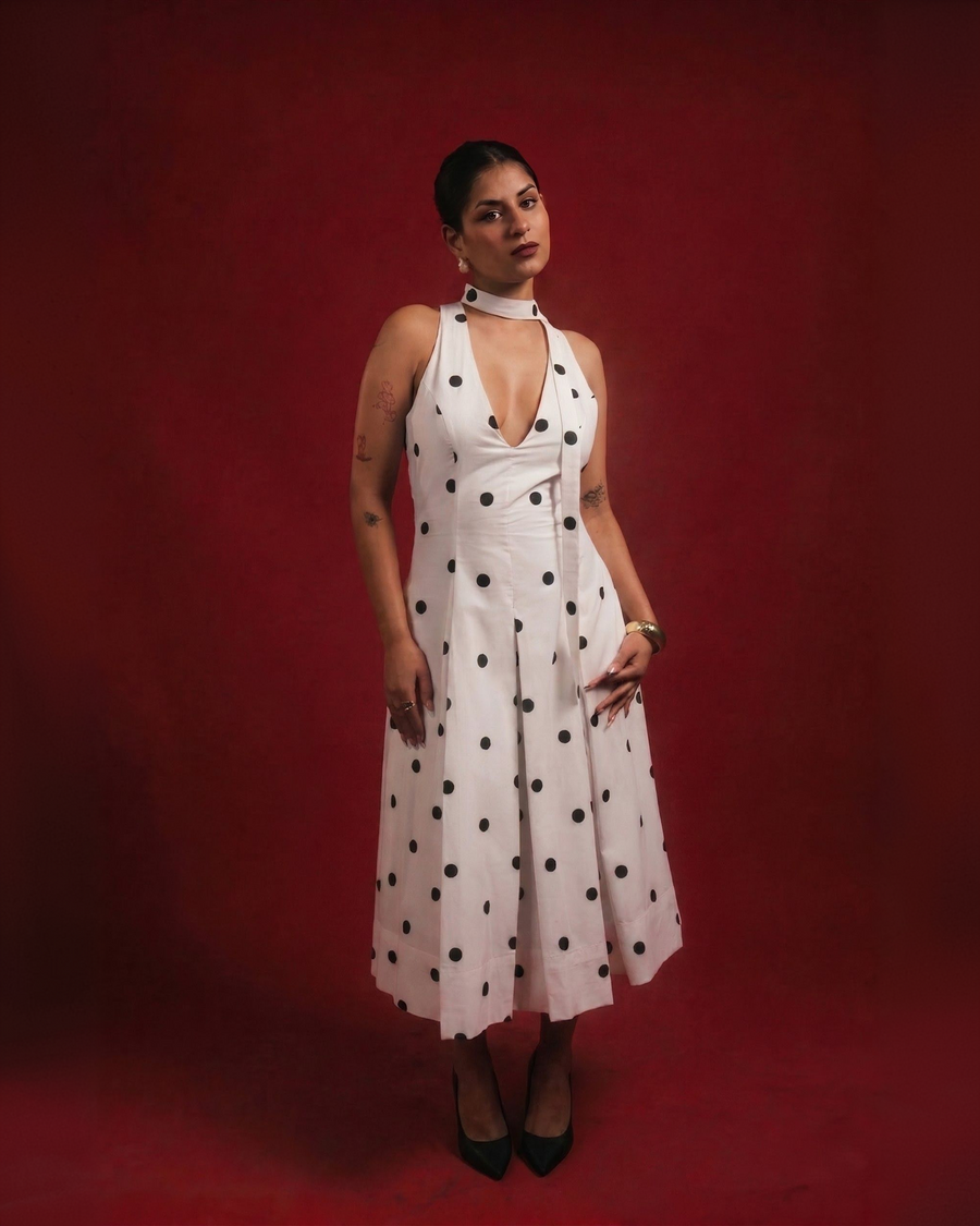 DOMINADOT white polka dot midi dress with scarf neckline and box-pleated skirt – front view – YUMIS