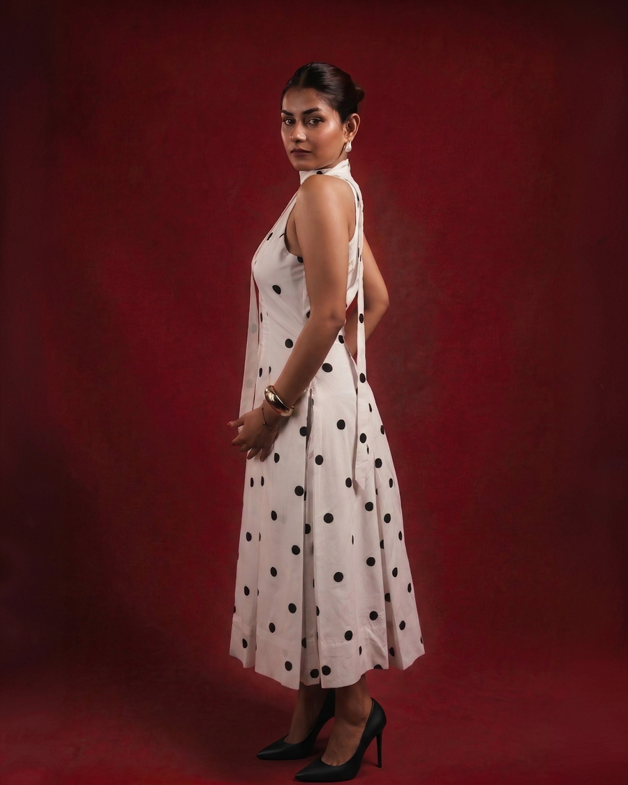 DOMINADOT white polka dot midi dress showing back scarf trail and pleated skirt – side view – YUMIS