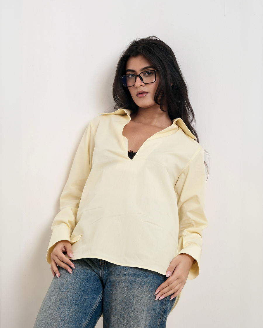  POPOVER SHIRT butter yellow cotton poplin shirt showing open V neckline and curved hem detail – YUMIS