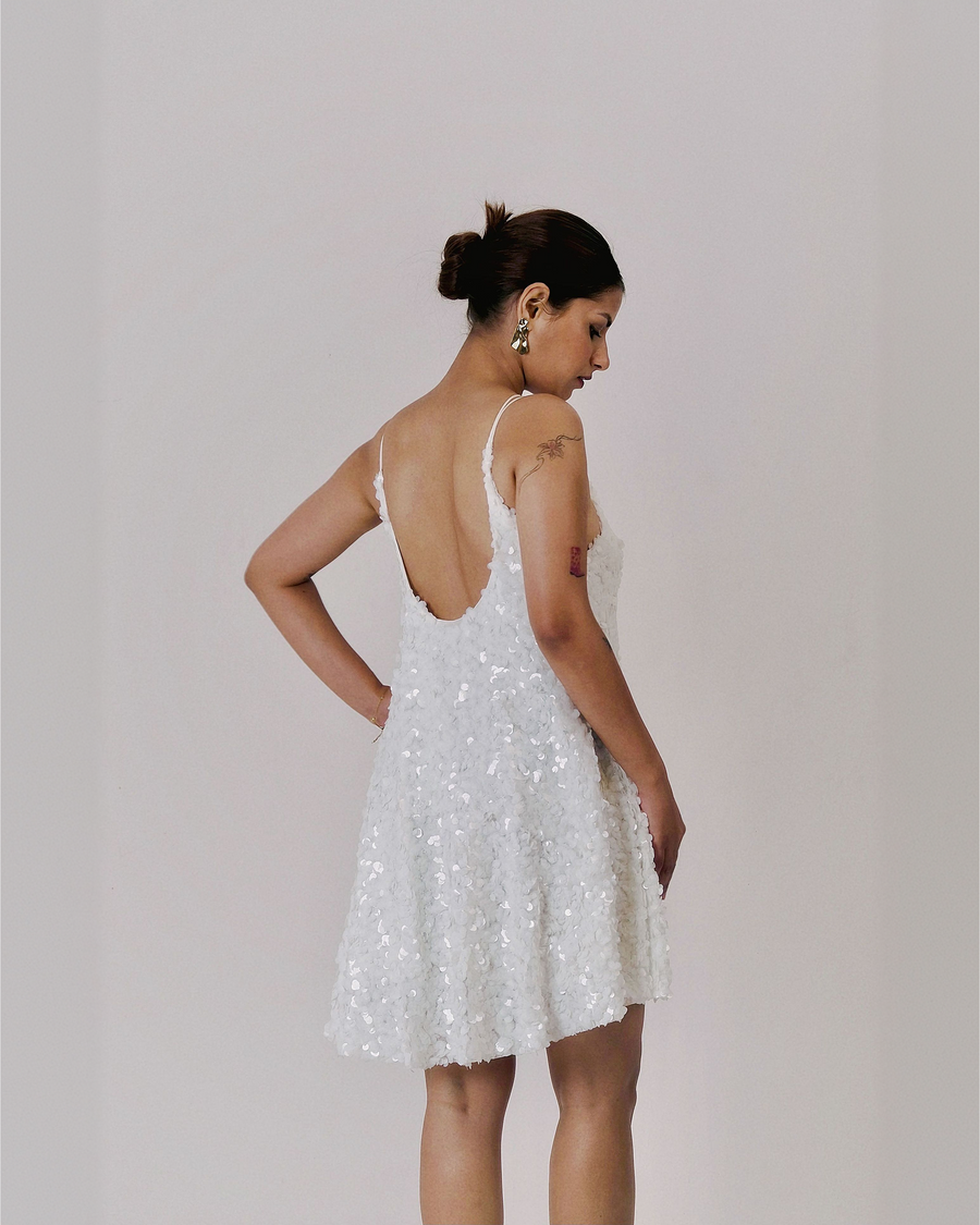 UNBOUND MINI white embellished mini dress showing open back and cross strap detail – back view – YUMIS