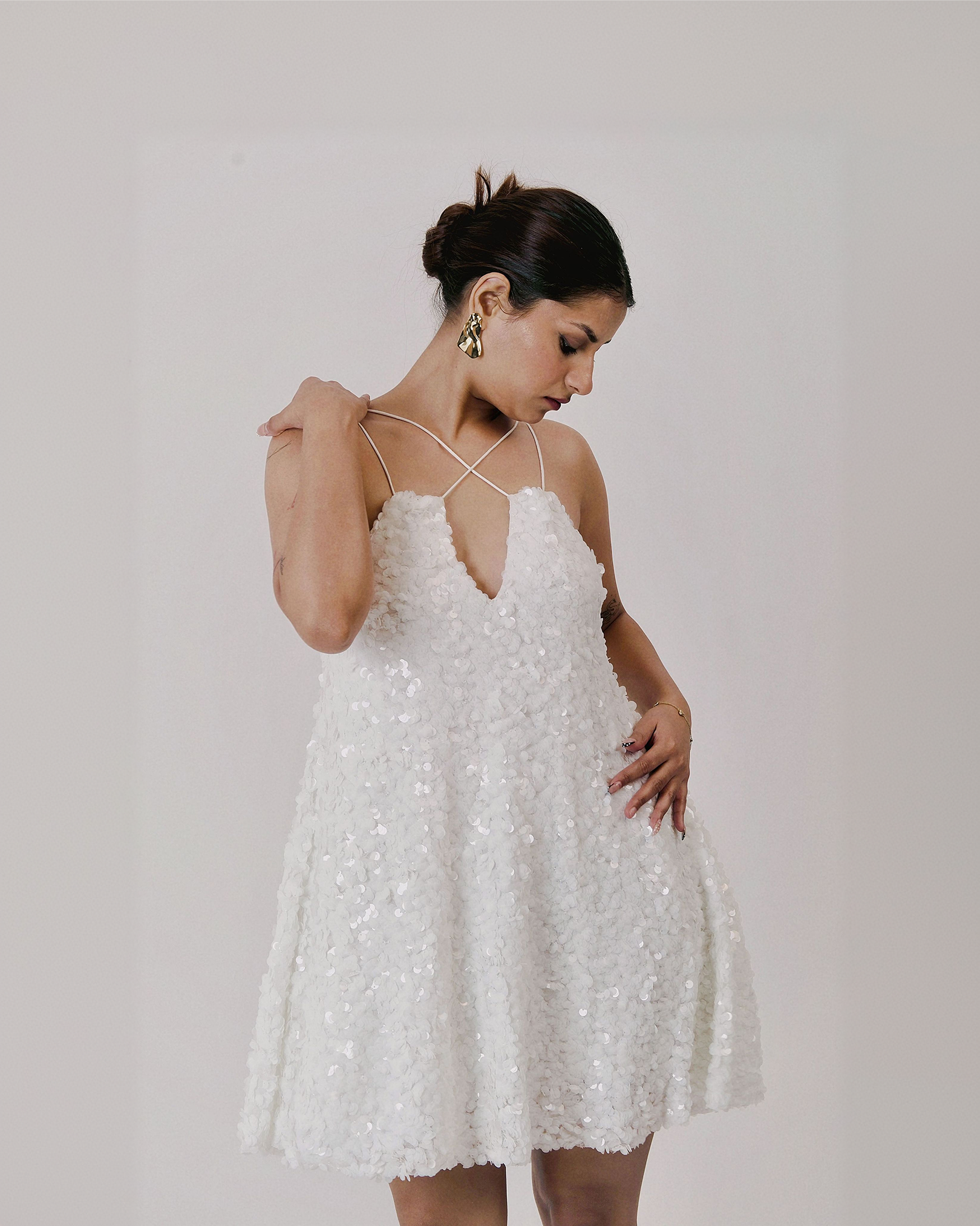 UNBOUND MINI white embellished A-line mini dress with deep V neck and cross-back straps – front view – YUMIS