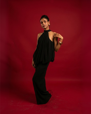 WHISPER black chiffon open-back halter jumpsuit with wide leg – front view – YUMIS