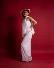 WHISPER white chiffon open-back halter jumpsuit with wide leg – editorial front view – YUMIS